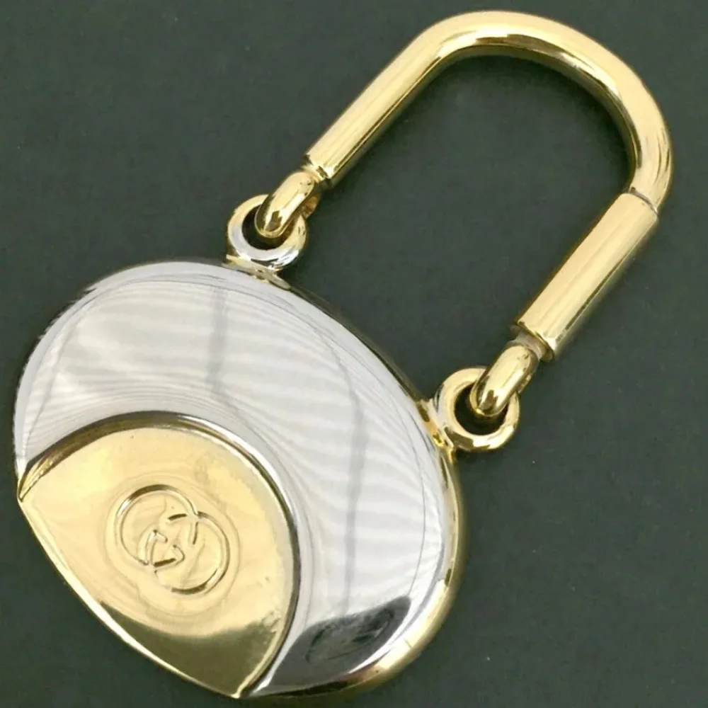 GUCCI INTERLOCKING G SILVER GOLD TONE KEY RING CHARM/UT1930 (UNISEX).